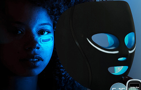 Close-up of Shark CryoGlow face mask highlighting under-eye cryotherapy cooling feature with woman visible in frame to demonstrate treatment area 