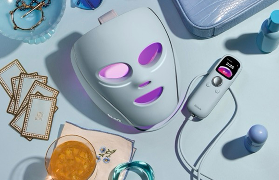 Shark CryoGlow LED face mask with cryotherapy cooling shown alongside handheld remote controller for customised at-home skin treatment