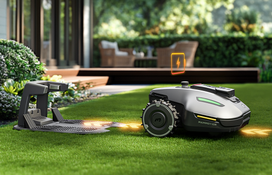 Mammotion robotic lawn mower returning to its charging station in a landscaped backyard