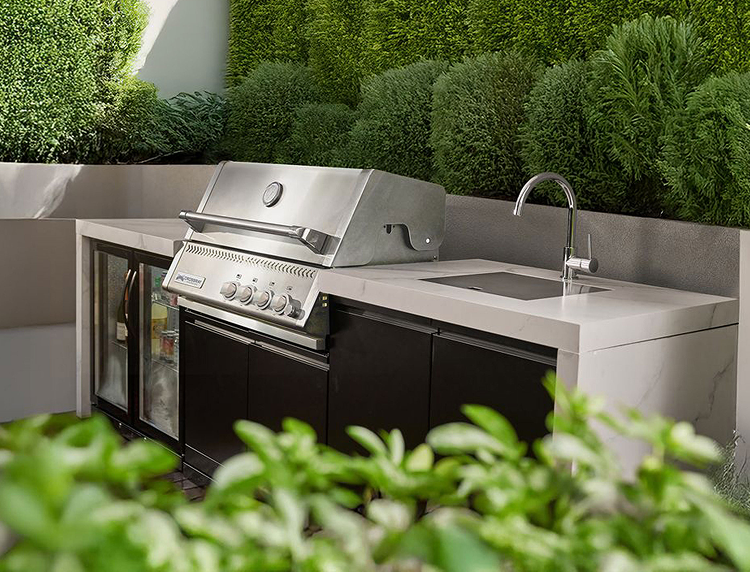 Outdoor kitchen with built-in stainless-steel BBQ, sink and bar fridge 