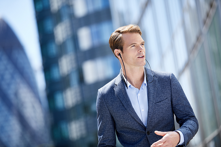 Man wearing the Jabra in-ear headphones