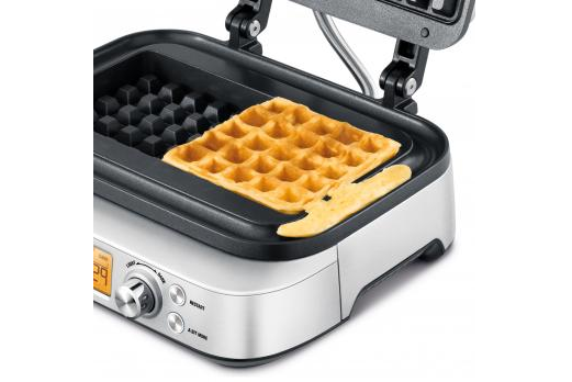 The Waffle Maker cooking waffles with handy overflow moat